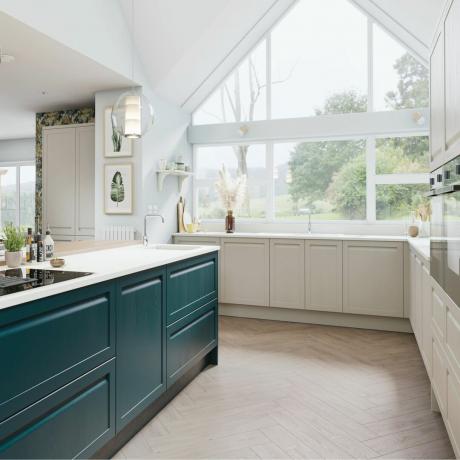 cocina con gabinetes de cachemira, pisos de madera, iluminación colgante de vidrio e isla blanca y verde azulado