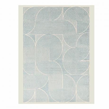 En krämfärgad matta med blått virvlat mönster